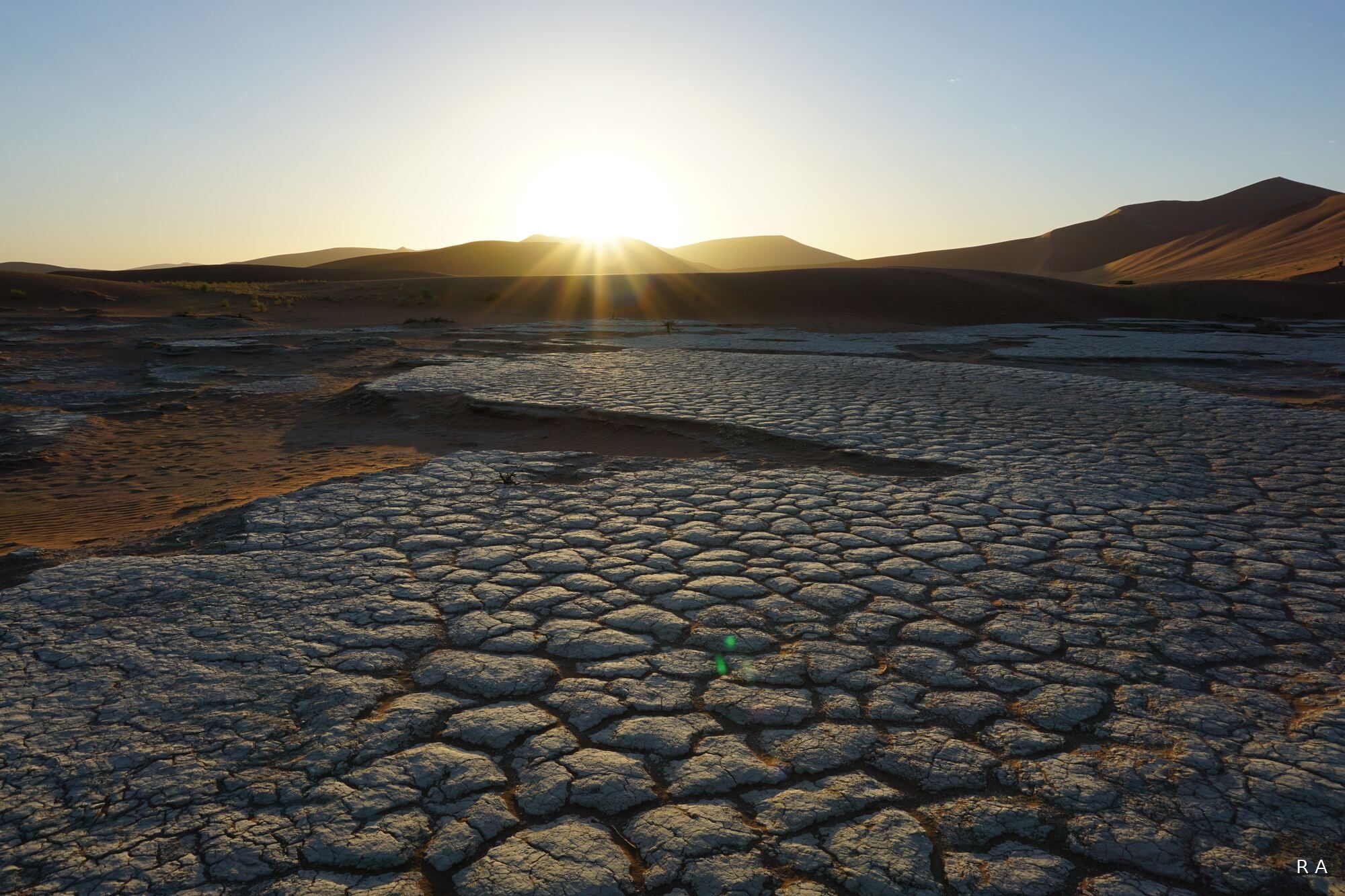 Sunrise over cracked earth, Namib desert